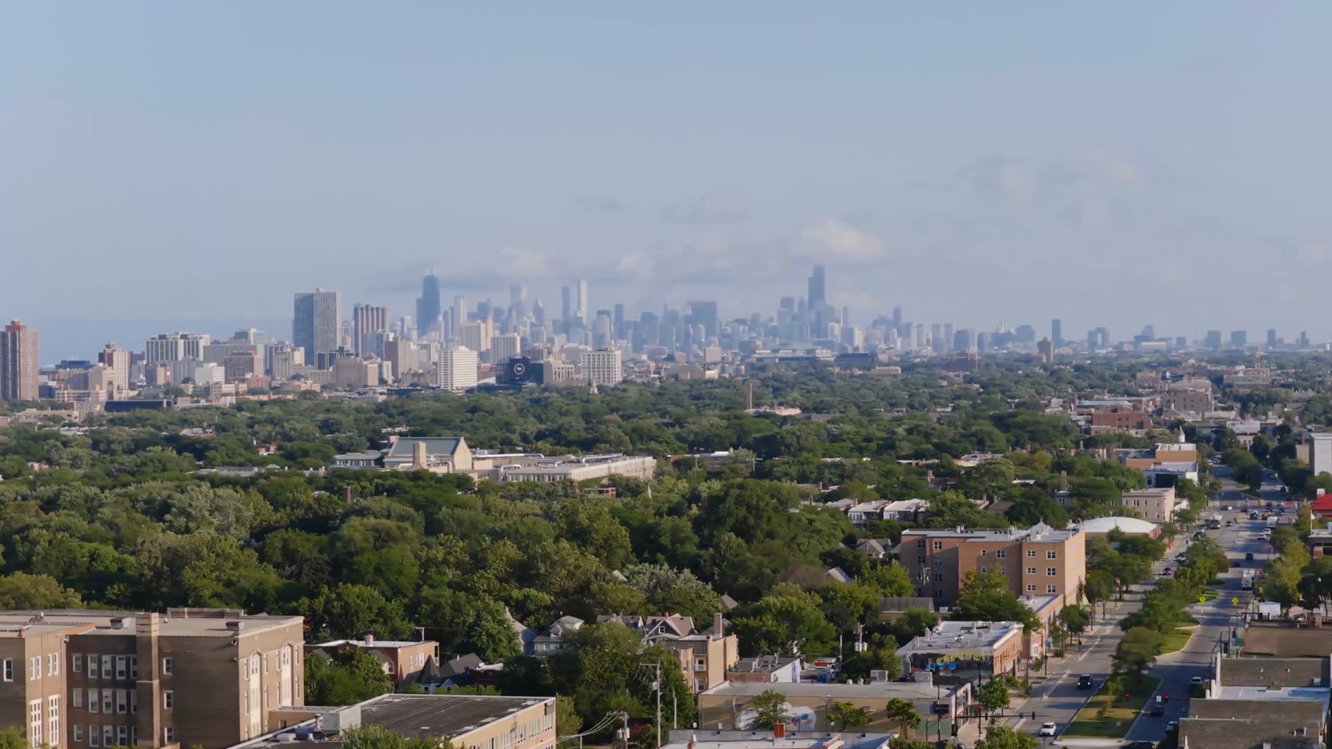 Aerial view of a Chicago western suburb with the downtown skyline in the distance